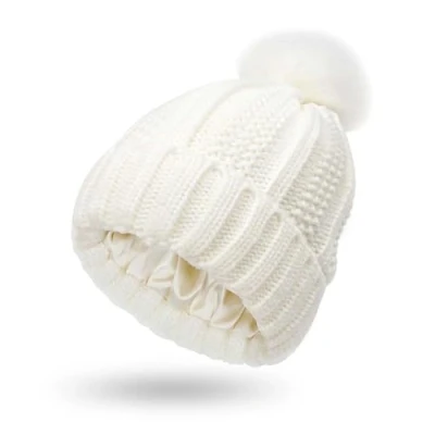 Bild av Bcenoilua Vinter varm stickad mössa kvinnor stretchig tjock kabelstickad värmeisolerande satin fodrad med fuskpäls pompom utomhus hatt, Vitt, en storlek