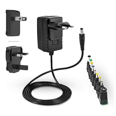 Bild av LEICKE Universal Power Supply 12V 2A TÜV Laddare 24W med 9 olika adapterhuvuden för små enheter: LCD, WLAN router, hubb, LED band, extern hårddisk, TFT skärm, switch 2000mA 1A