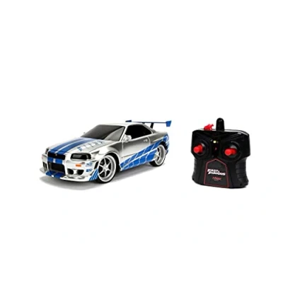 Bild av Jada Toys Fast &amp; Furious RC bil, 2002 Nissan Skyline GT R, R34, fjärrstyrd turbofunktion, 2 kanals radiofjärrkontroll, USB laddningsfunktion, inklusive batterier, 1:16, blå/silver