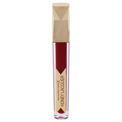Bild av Max Factor Honey Lacquer Floral Ruby 25 Läppstiftsfärg, läppglans glans och läppbalsam fukt i ett djärv färg, smidig glänsande