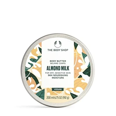 Bild av The Body Shop ALMOND MILK kroppssmör mandelmjölk för torr och känslig hud 96H fuktgivande sheasmör sesamolja vegansk kosmetika förpackning 200 ml