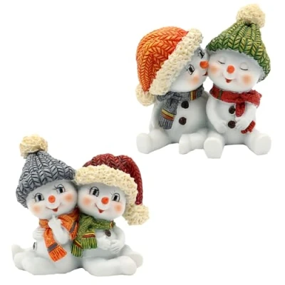 Bild av Dekohelden24 Set om 2 snöiga barn, med mössa och halsduk i rött, grått, orange grönt, sittande (L x B H) 5,5 3,5 cm